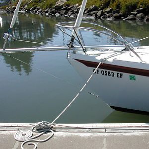 The bowsprit is the collapsed whisker pole. It slides through a custom made stainless steel/pvc bow loop and is secured with a pole chock aft. The bob